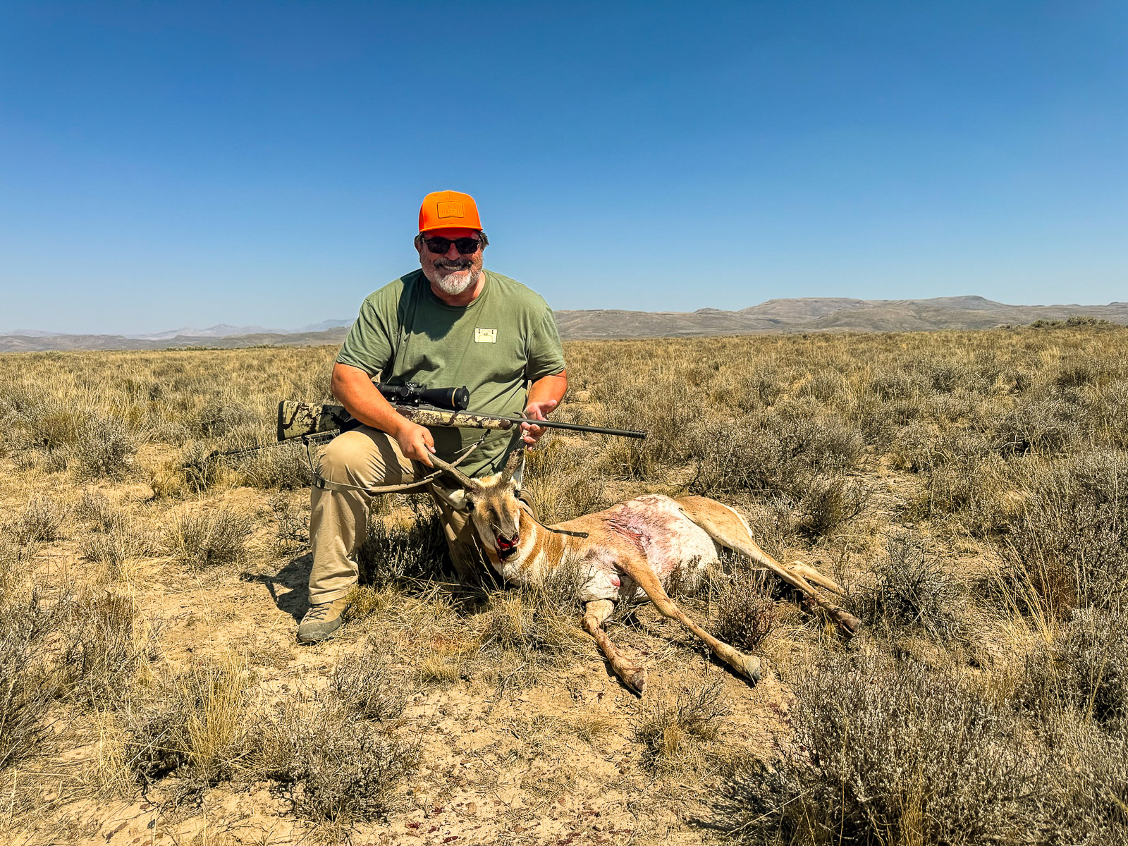 A hunter with a harvested pronghorn antelope